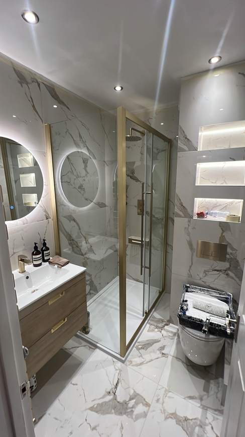 Marble bathroom with walk-in shower and brushed-gold fittings