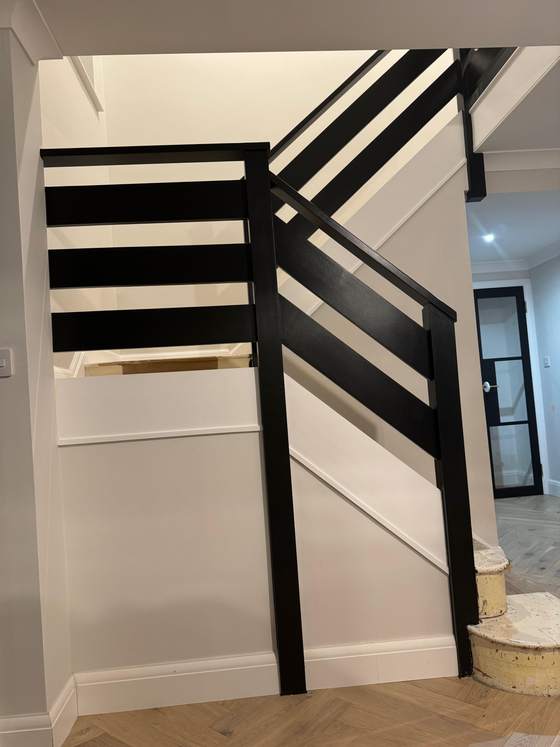 Staircase with black balustrade