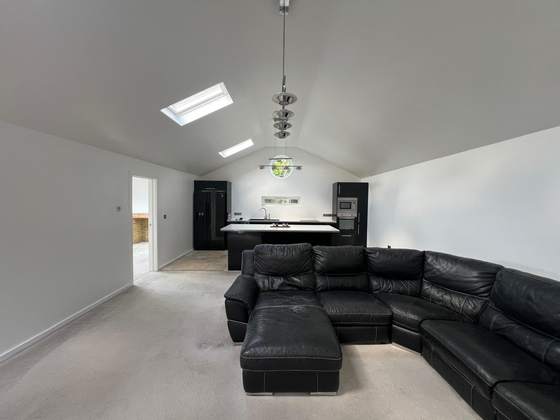 Loft conversion living space with kitchen